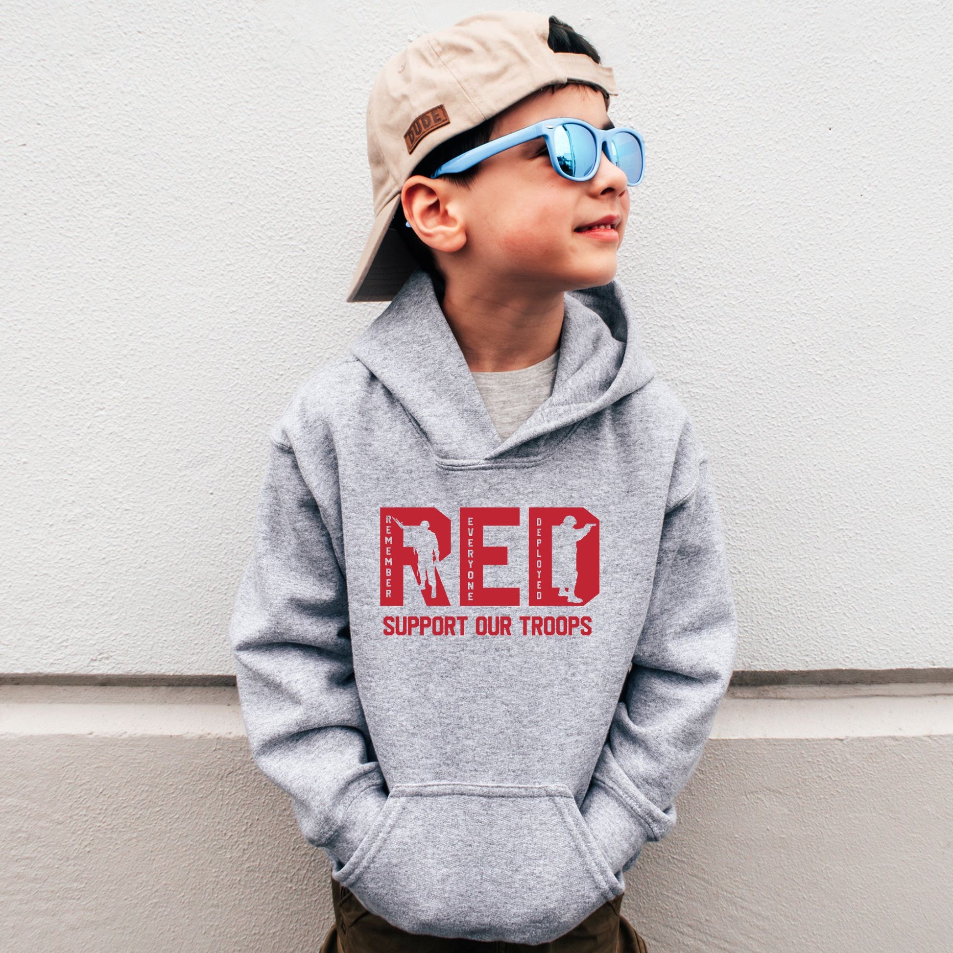 Rakkgear Youth "Remember Everyone Deployed" Grey Hoodie: Grey hoodie with RED letters and 'Support Our Troops' on the front. Iconic Rakkgear Logo on the upper back