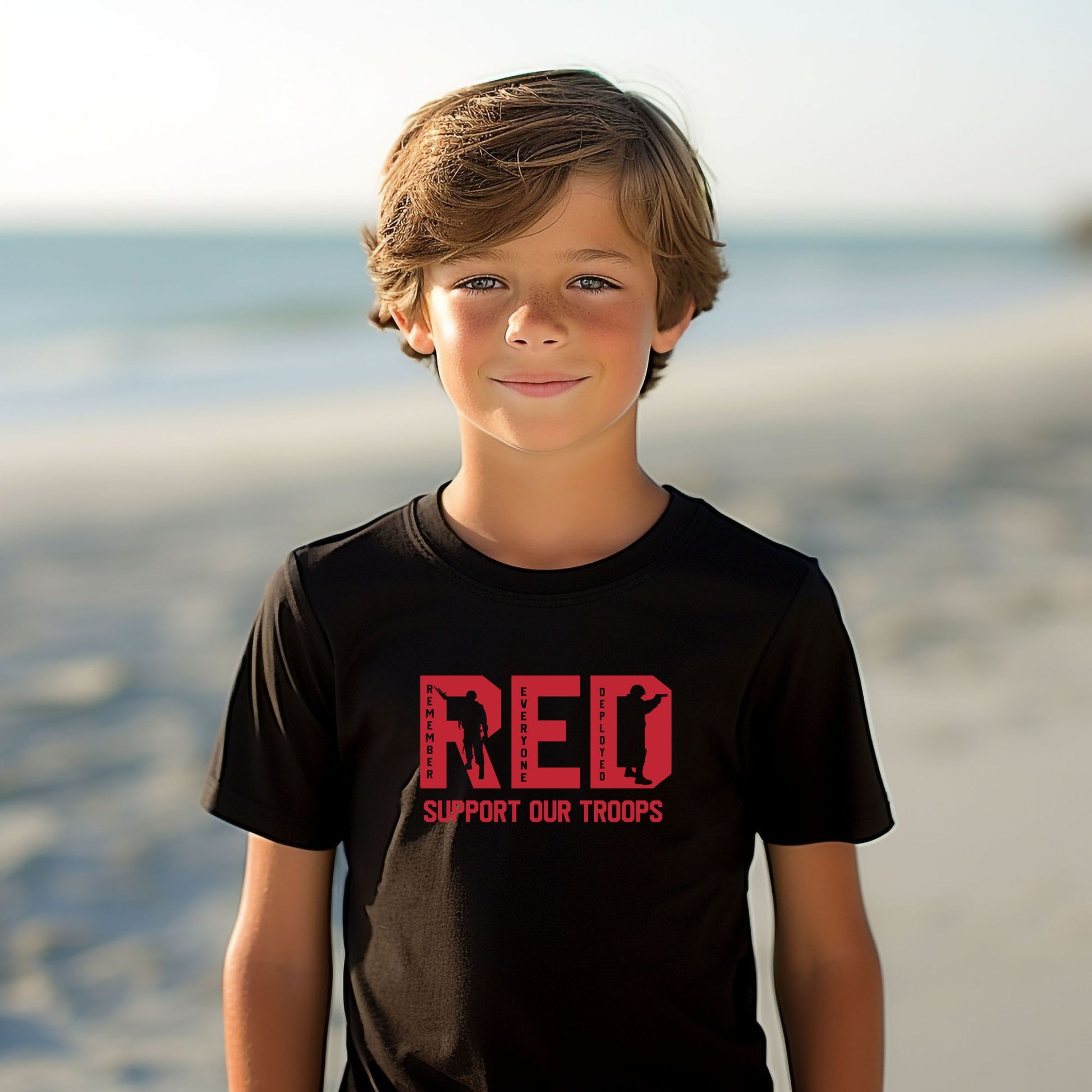 Rakkgear Youth "Remember Everyone Deployed" Black Tee: Black t-shirt featuring RED letters with 'Support Our Troops' on the front. Iconic Rakkgear Logo on the upper back.