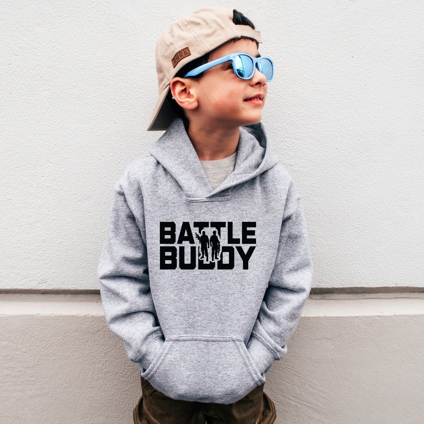 Rakkgear Youth "Battle Buddy" Grey Hoodie: A stylish grey hoodie with 'Battle Buddy' on the front and the iconic Rakkgear Logo on the upper back, combining fashion and camaraderie for the spirited youth