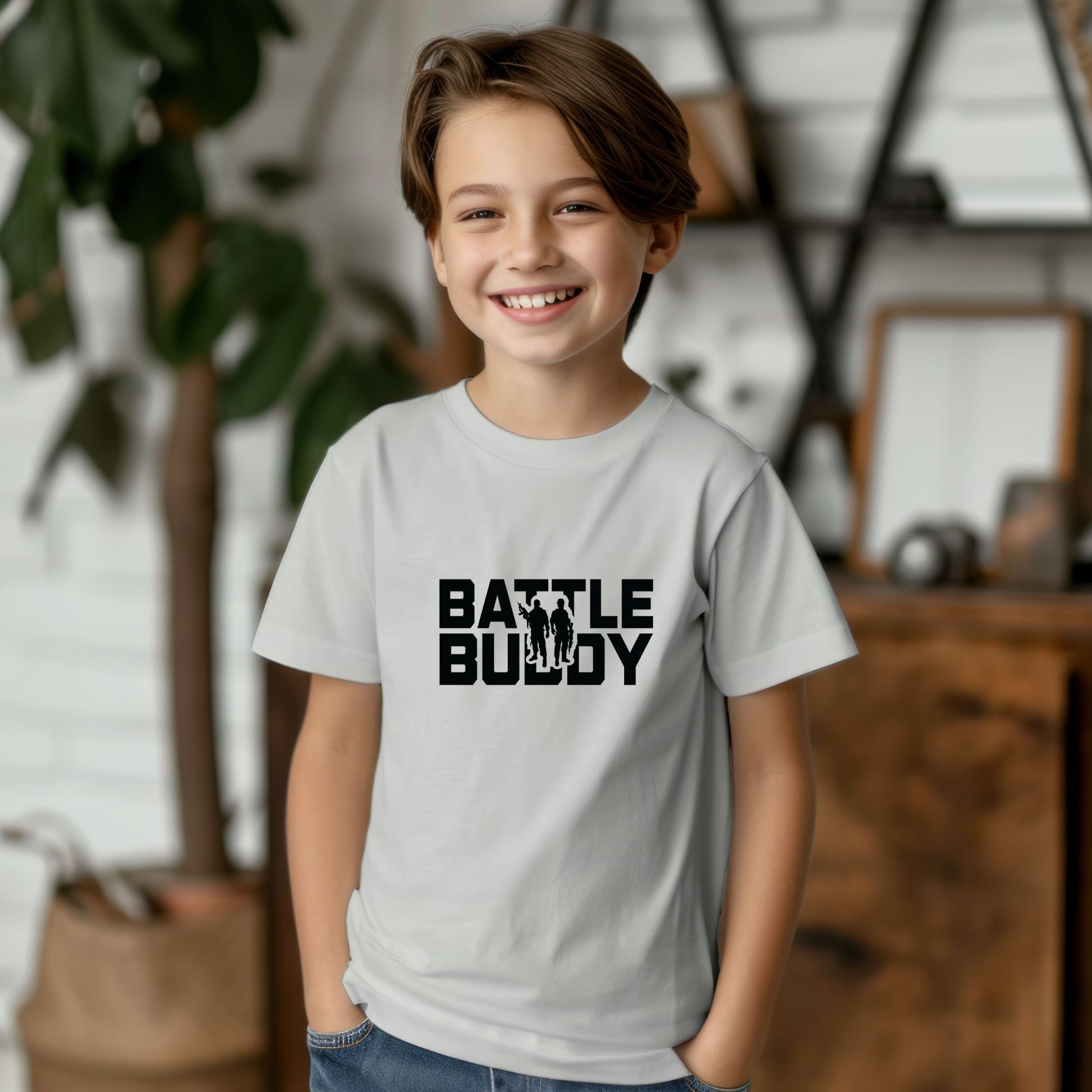 Rakkgear Youth "Battle Buddy" Grey T-Shirt: Grey tee featuring 'Battle Buddy' on the front. Iconic Rakkgear Logo on the inner upper back.